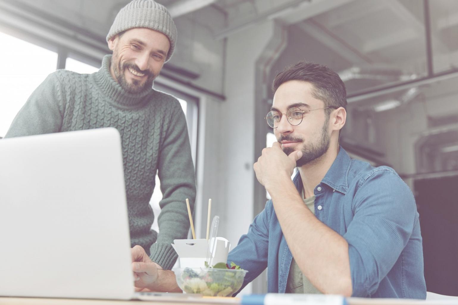 Students learning digital budgeting techniques in interactive workshop environment